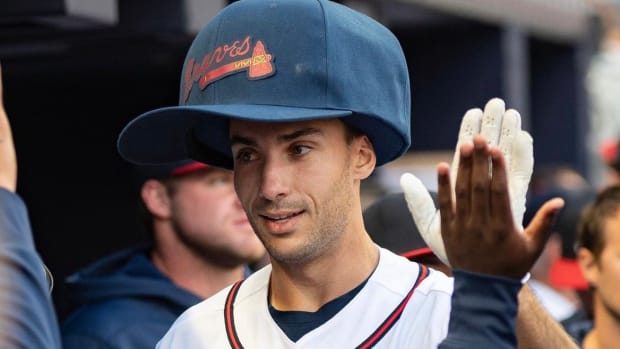 Matt Olson wears the "Big Hat" to celebrate a homerun in the Braves dugout